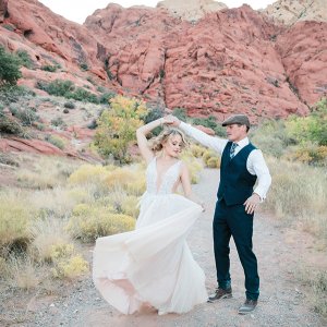 bride and groom in desert