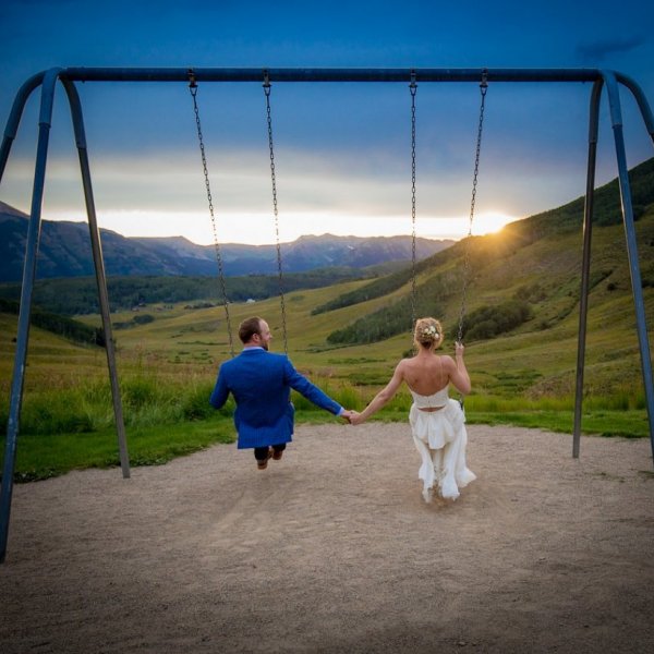 bride and groom on swings